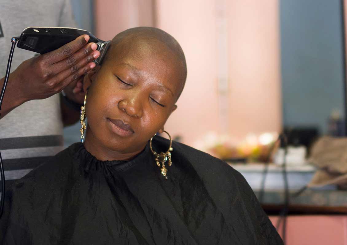 lady having her hair chopped off at withthegoodhair