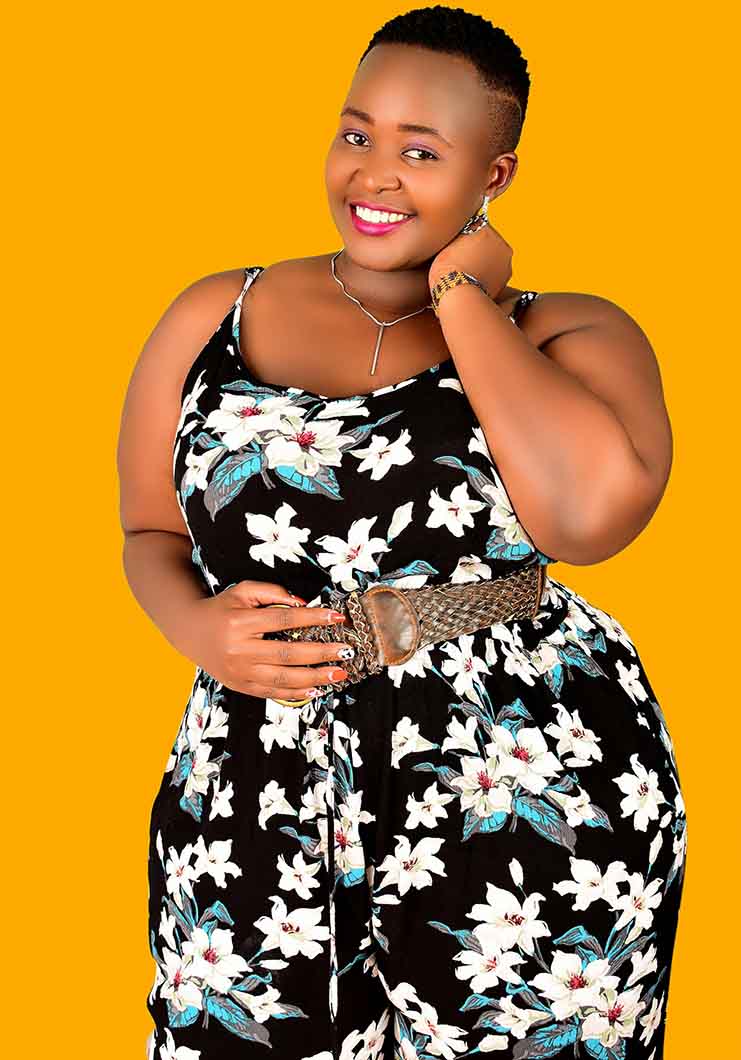 Woman with short afro showing lessons learnt since going natural