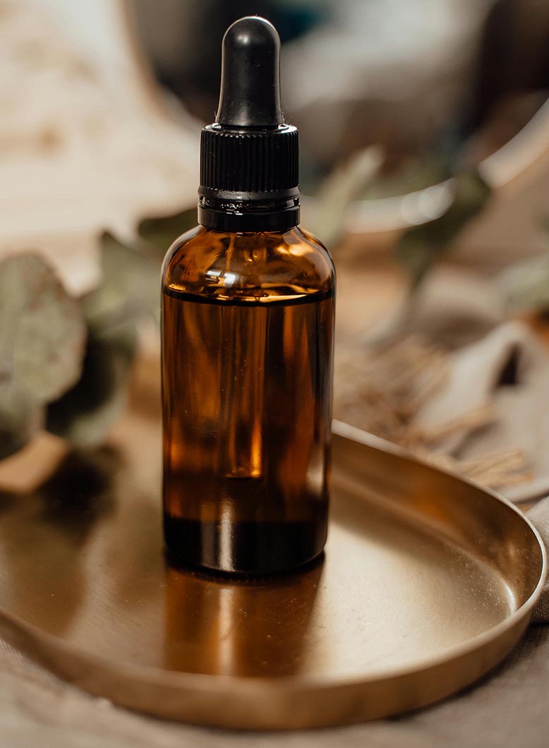 Almond oil in a brown glass bottle