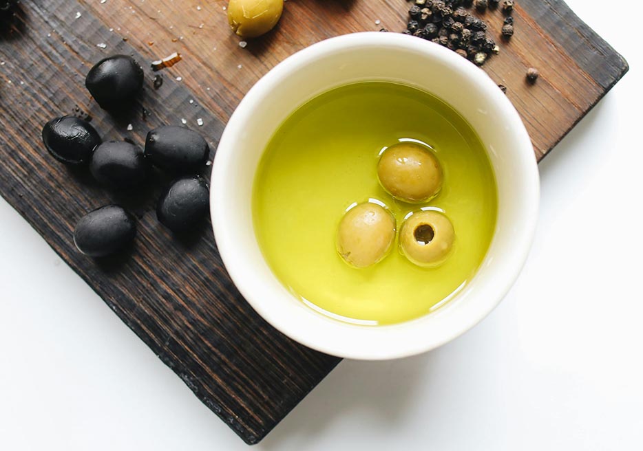 Olive oil in a white bowl
