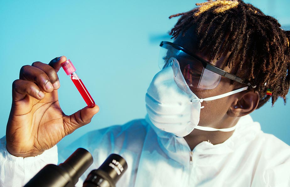 Doctor holding blood in vials showing the need to take a blood test