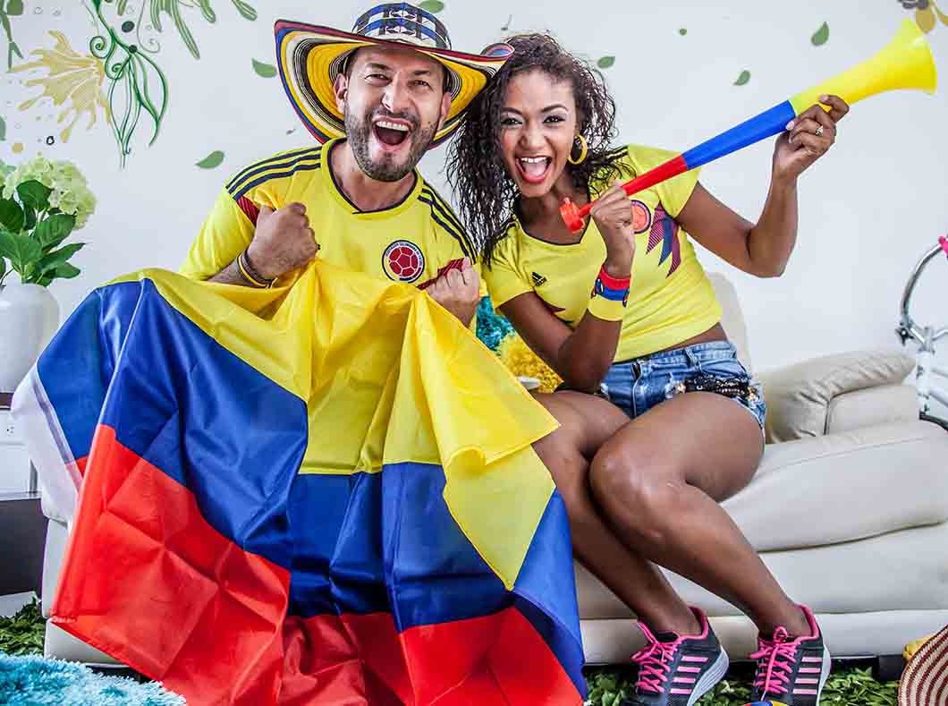 Couple celebrating with colorful flag