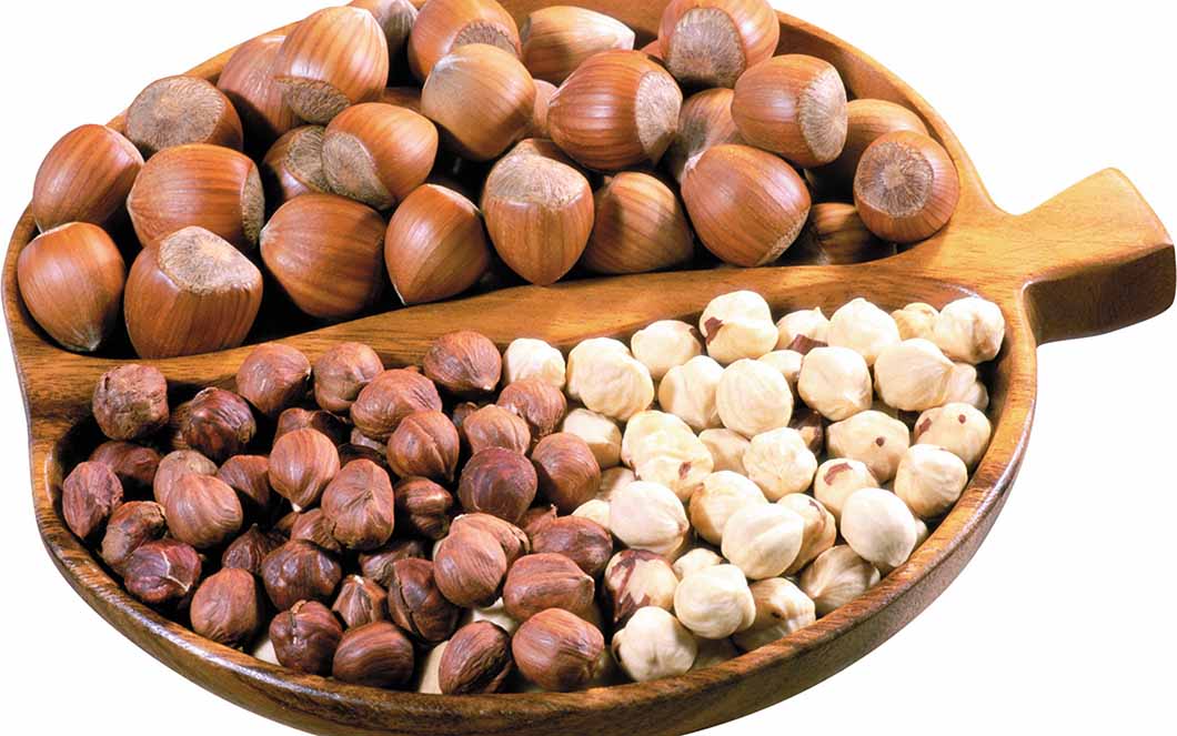 Nuts on a tray showing how they are great for preventing hair loss