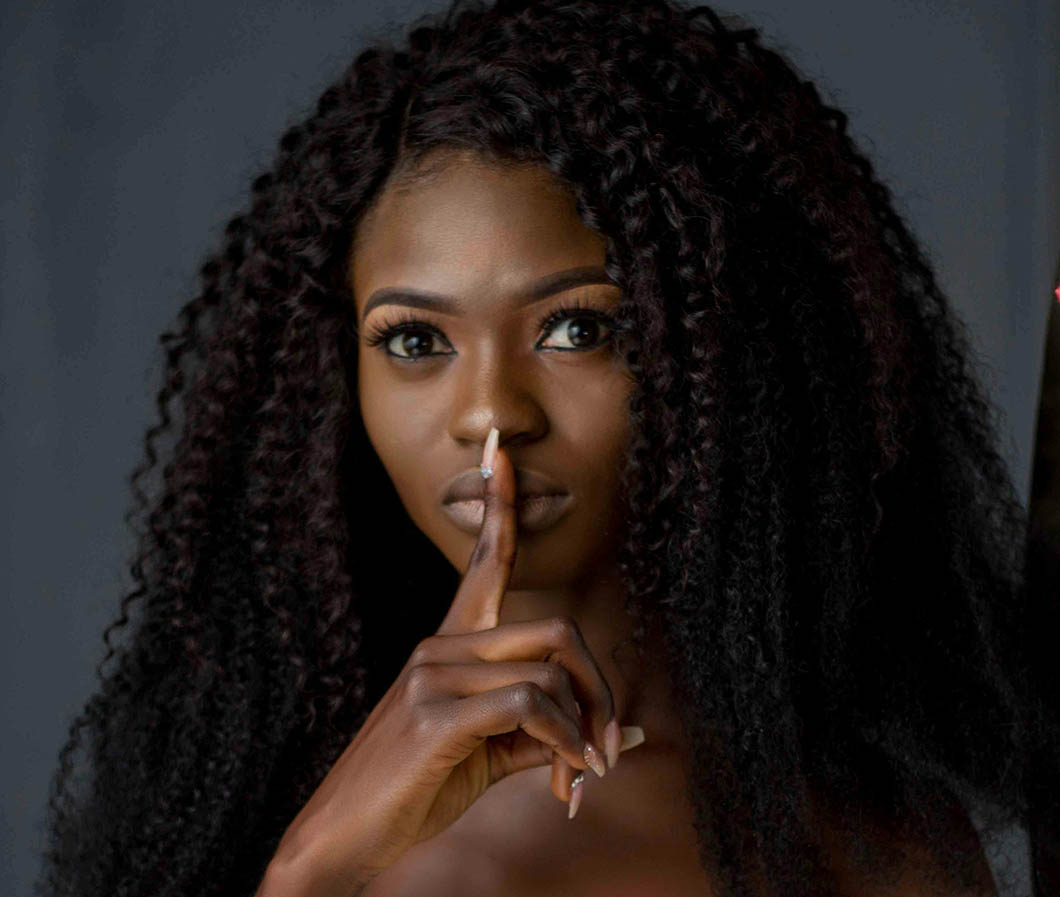 Girl with long, spiral synthetic hair