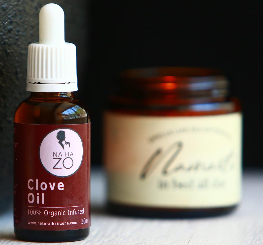 Clove Essential Oil made by Natural Hair Zone on a table