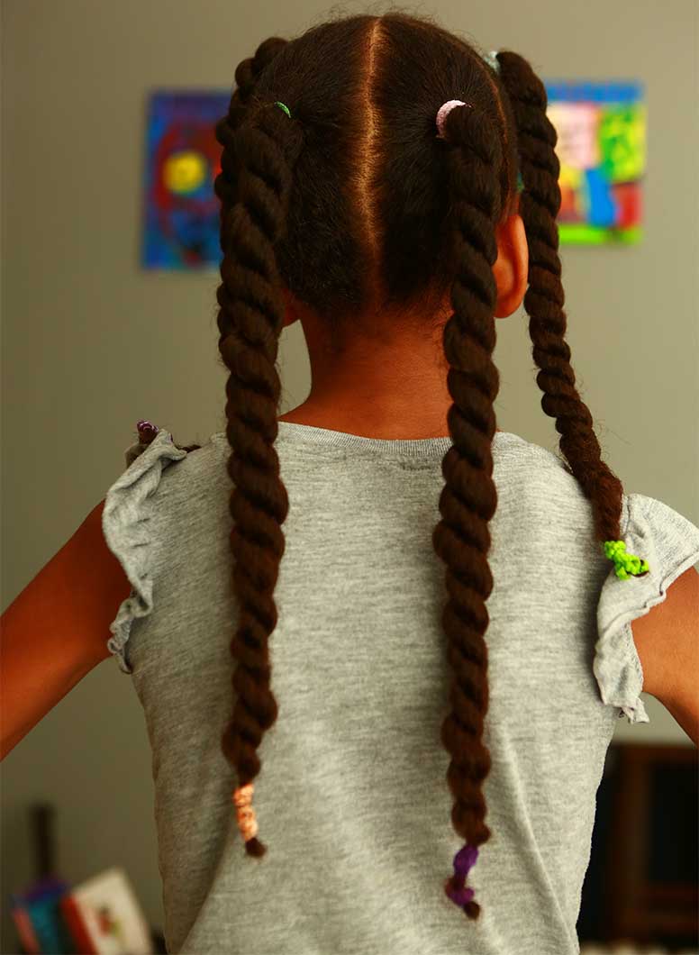 Little girl showing 3c hairstyle of the week for children