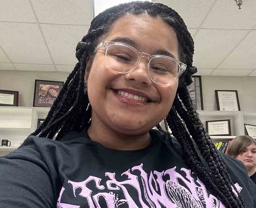 Girl with 3c natural hair in braids.