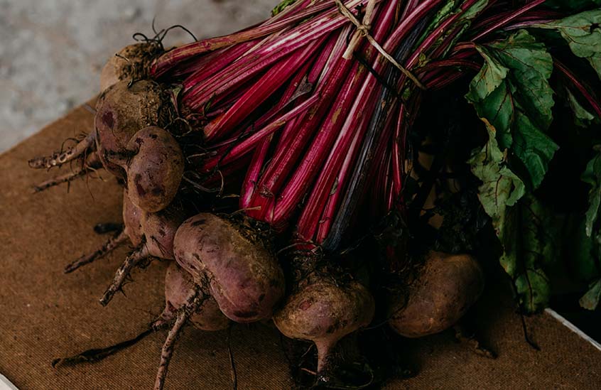 Beetroot on a table showing its iron-rich properties for hair growth.