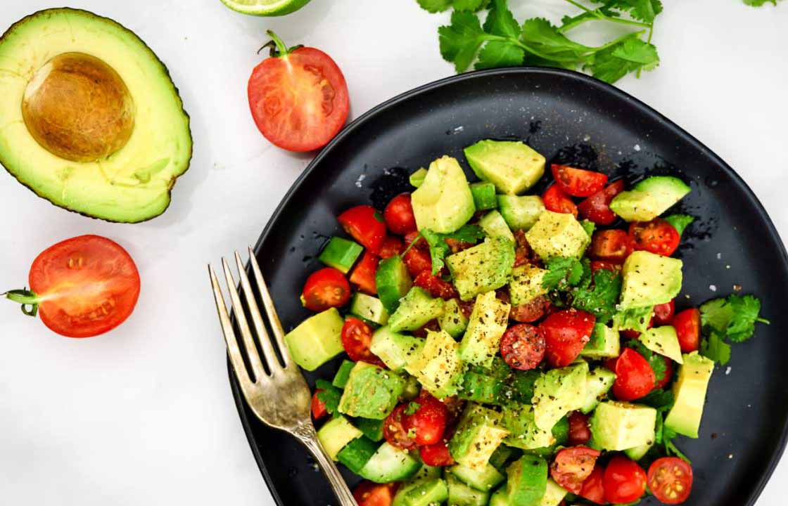 Iron rich avocado, cucumber and tomato recipe on a plate.