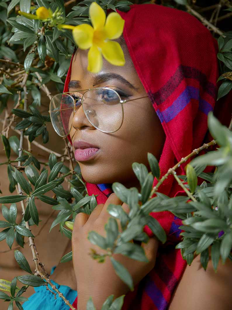 Woman in a headscarf and glasses