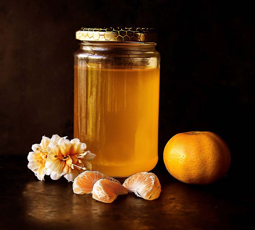 Honey in a jar to show how diy honey and hair mask can be used to hydrate natural hair