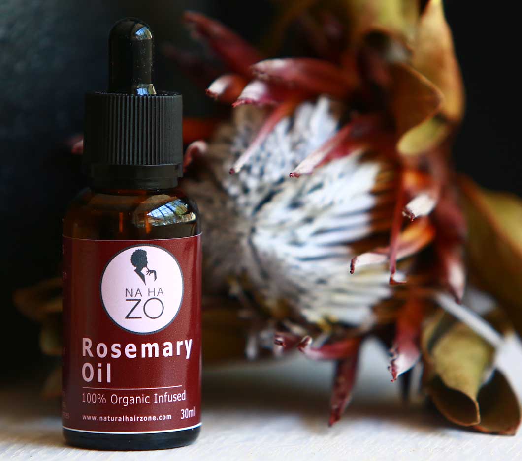 Rosemary Essential Oil made by Natural Hair Zone on a table