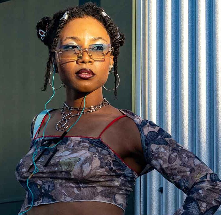 Girl with bantu knots getting her vitamin D from the sun