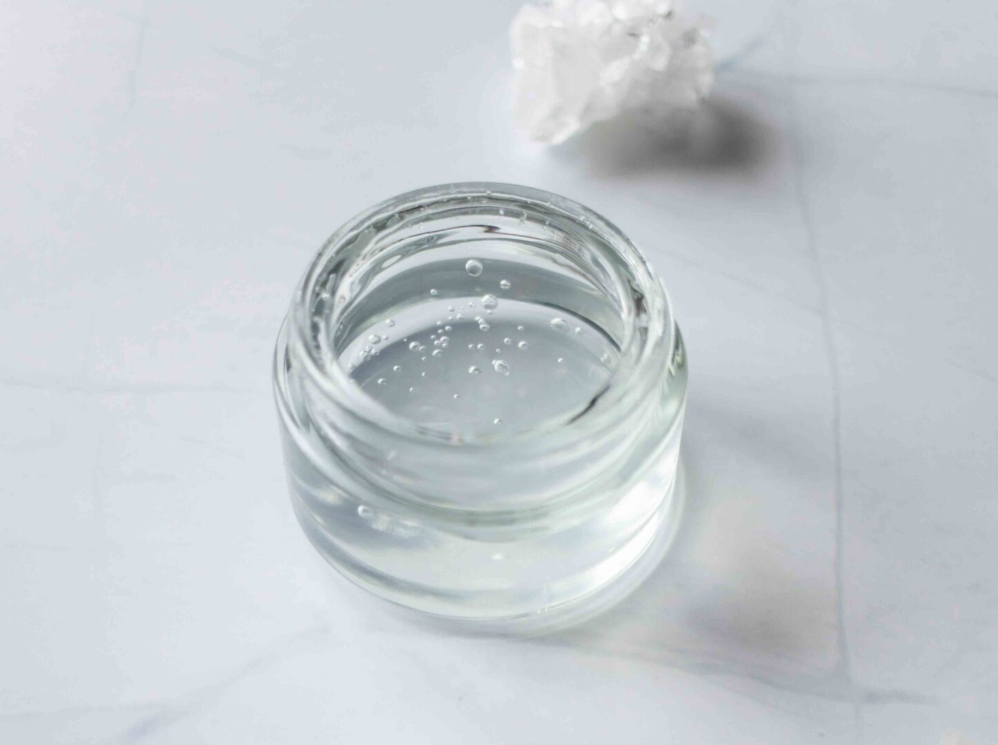 Xanthan gum hair gel in a clear, glass container